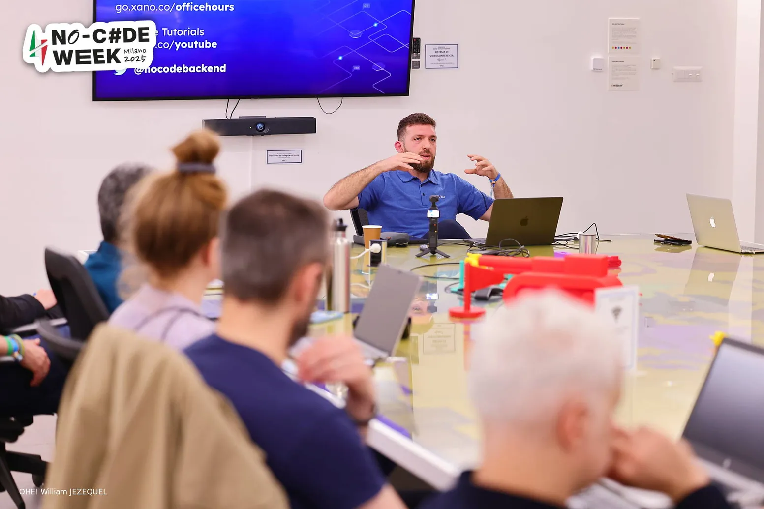 Daniel Petro consulting with a team